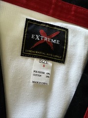 Size 5 (190) White taekwondo uniform with Red/black trimmed